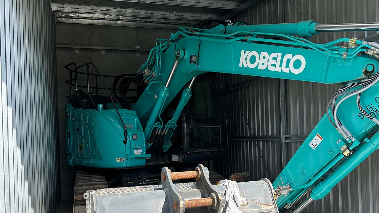 Zoomed in view of the excavatory and attachment in a storage unit.